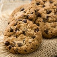 Bacon chocolate chip cookies on a burlap placemat.