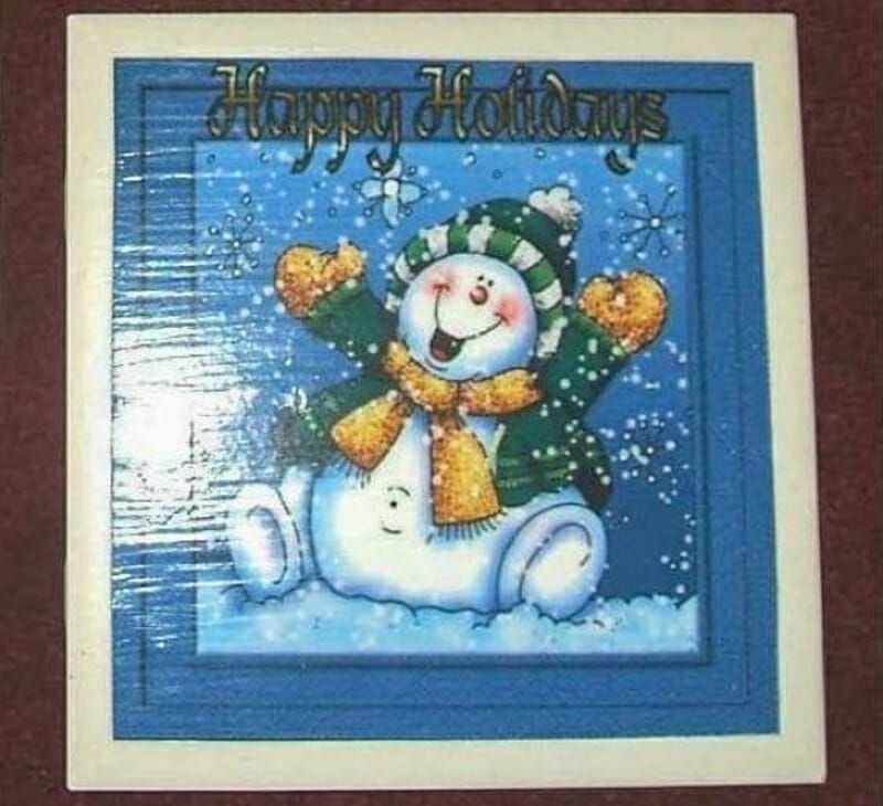 An old christmas card decoupaged onto a tile.