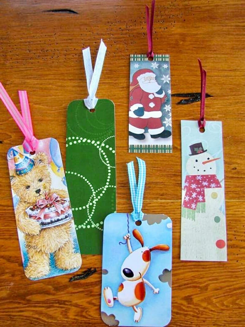 An assortment of bookmarks made from old christmas cards.