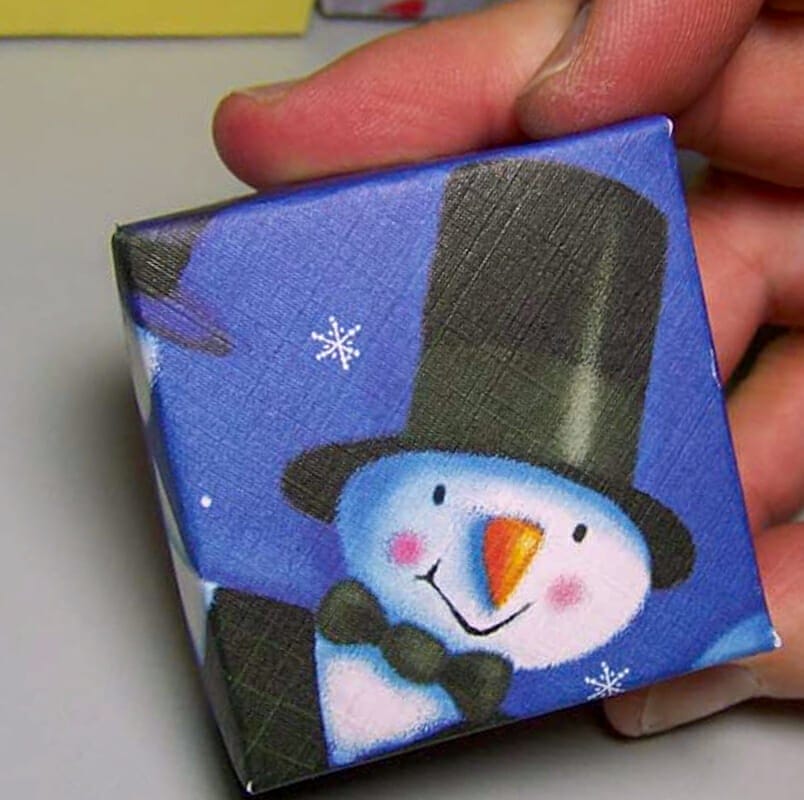 A small gift box made from a snowman christmas card.