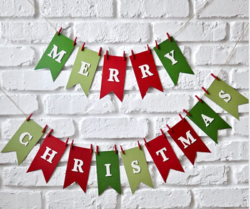 A red and green Merry Christmas paper garland.