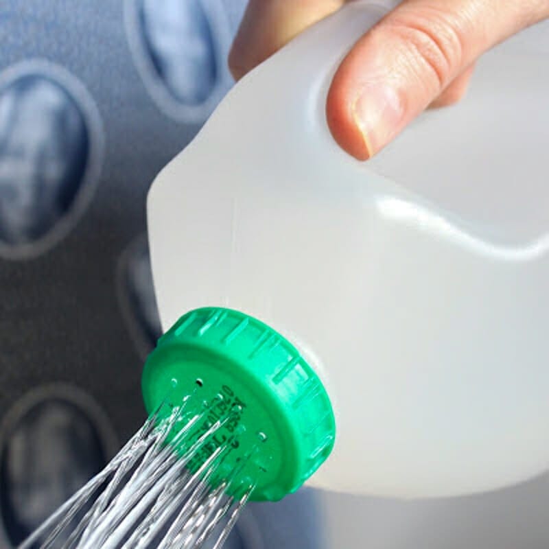 A milk jug watering can.
