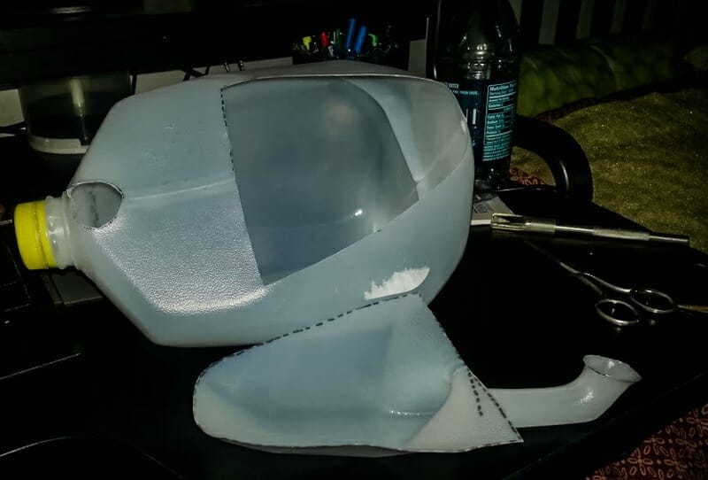 A dust pan/scoop cut from a milk jug.