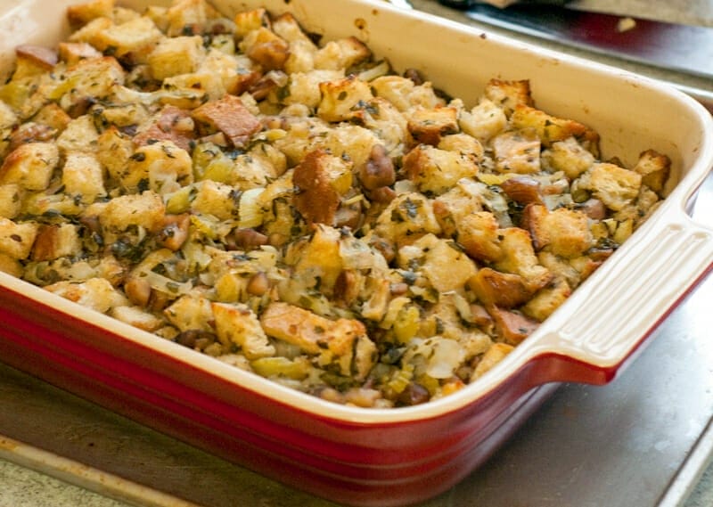 Stuffing in a red casserole dish.