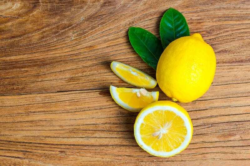 Lemons on a cutting board.