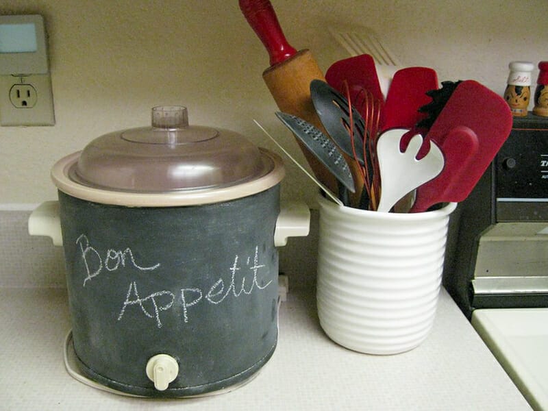 A slow cooker given a facelift with chalkboard paint.